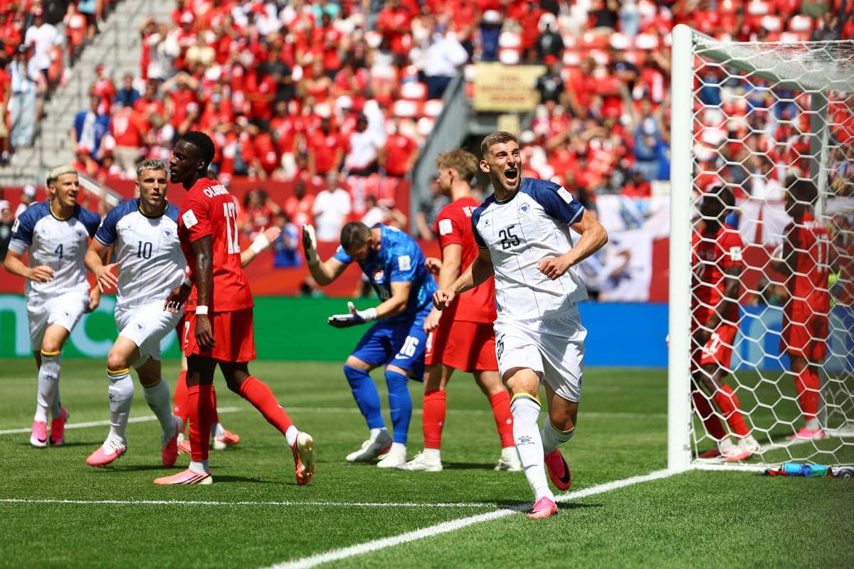 A wide shot of BMO Field in Toronto showing hundreds of empty blue seats during Canada's World Cup match against Bosnia and Herzegovina.