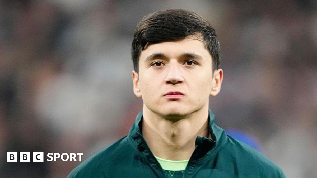 Abdukodir Khusanov in Manchester City kit lining up before a Premier League match