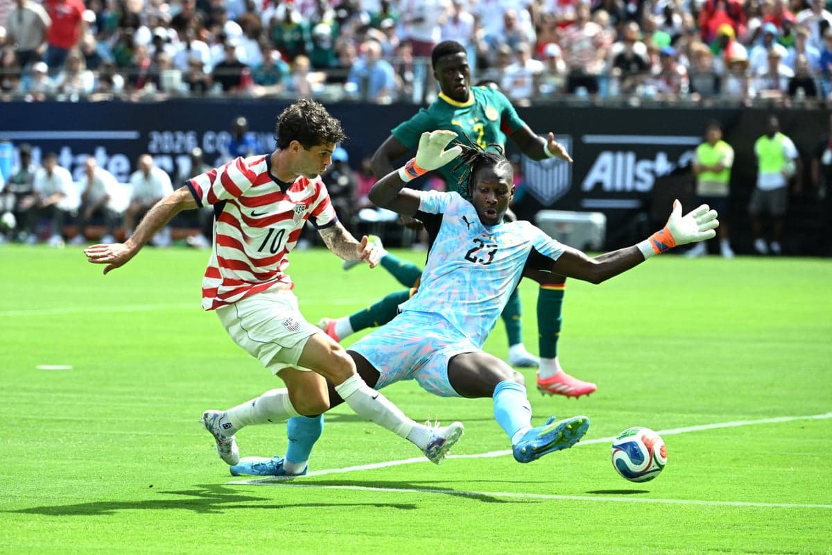 Christian Pulisic celebrates a goal during USMNT's 3-2 win over Senegal in a World Cup warm-up match.