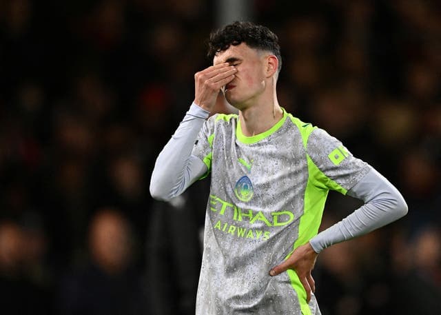 Cole Palmer and Phil Foden looking dejected, wearing England training gear, split-screen style against a backdrop of the Three Lions crest.
