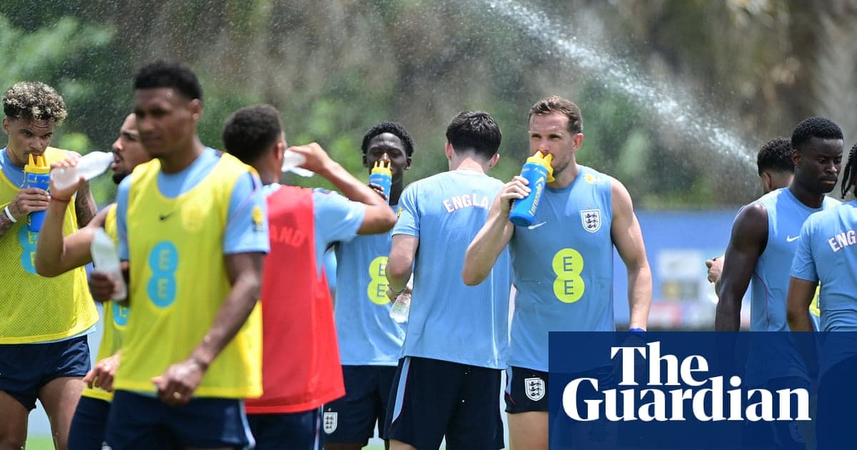 England players training in the heat at Palm Beach Gardens, with Jordan Henderson and teammates taking a water break.