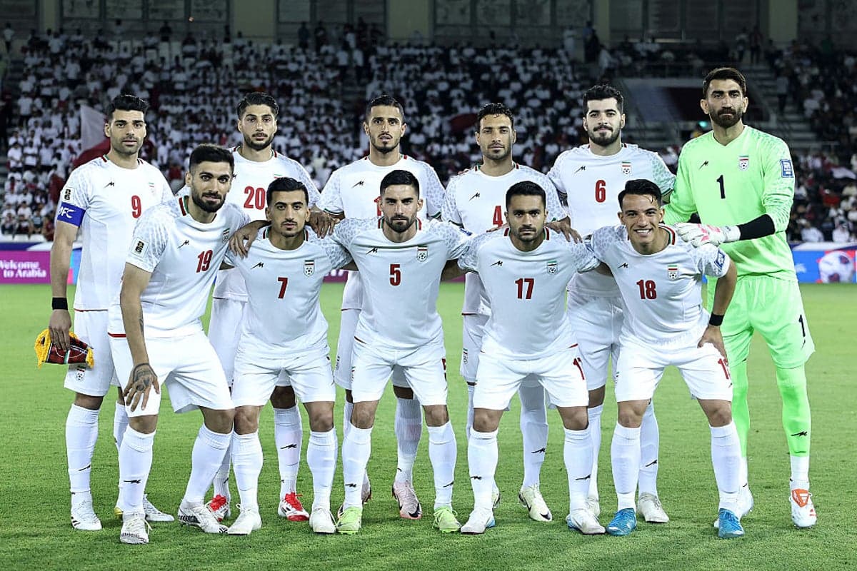 Iranian players including Seyed Hossein Hosseini and Ehsan Hajsafi outside the US embassy in Ankara for visa procedures.