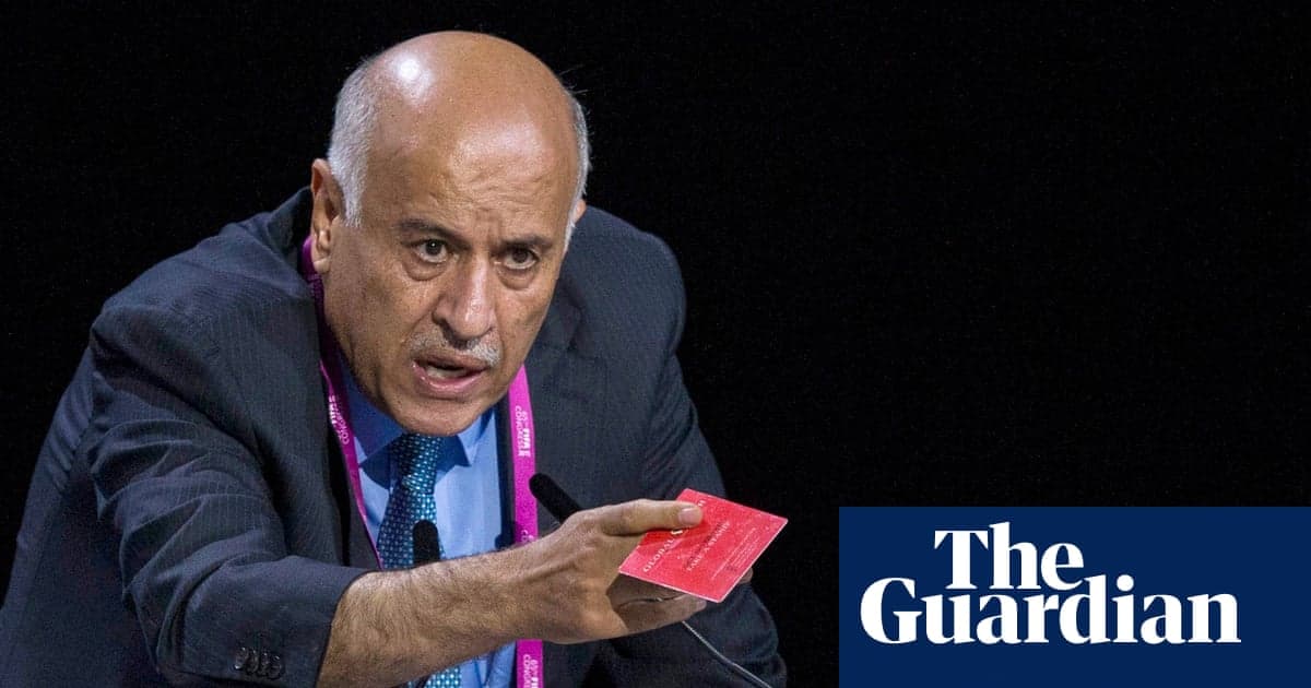 Jibril Rajoub, wearing a keffiyeh scarf, gestures emphatically while speaking at a podium with a FIFA congress banner in the background.