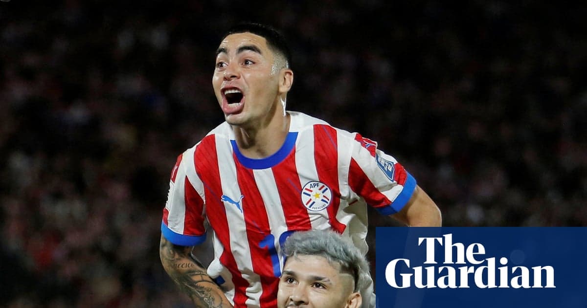 Julio Enciso and Miguel Almirón celebrate a goal for Paraguay.
