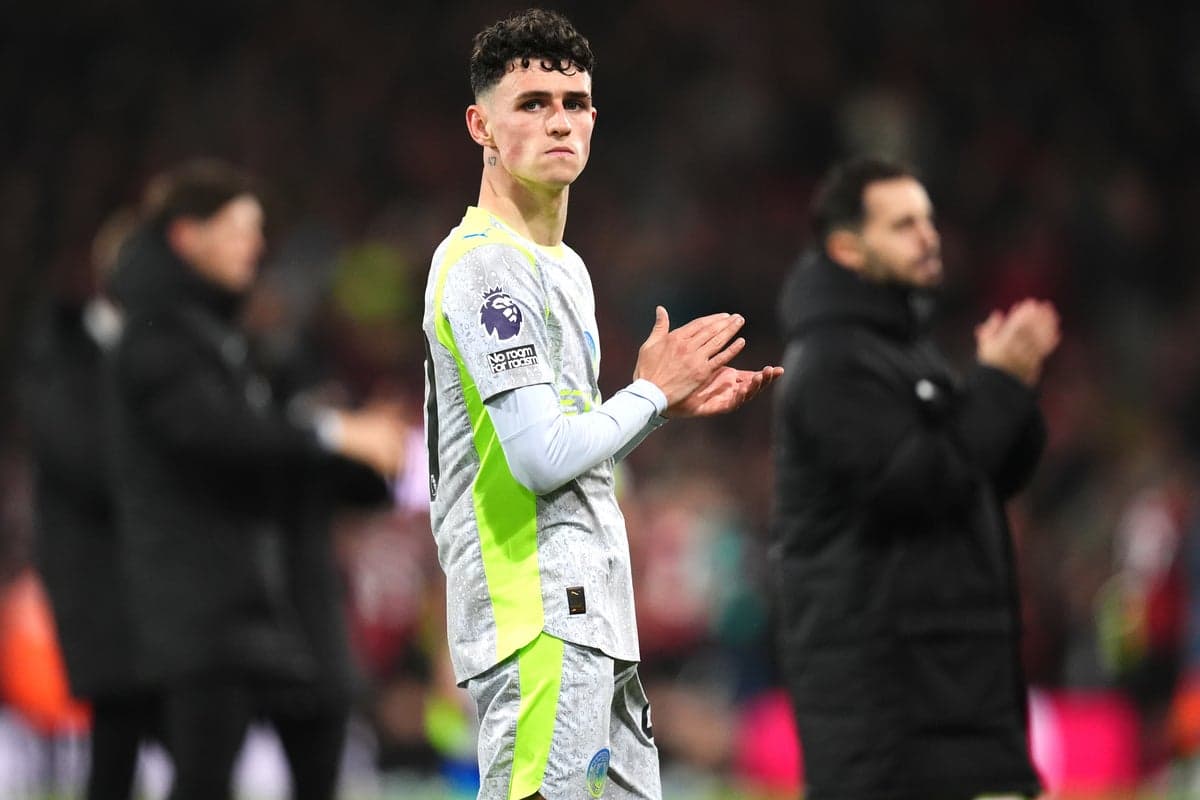 Phil Foden looking dejected on the pitch for Manchester City, symbolizing the form and positional struggles that led to his England World Cup squad omission.