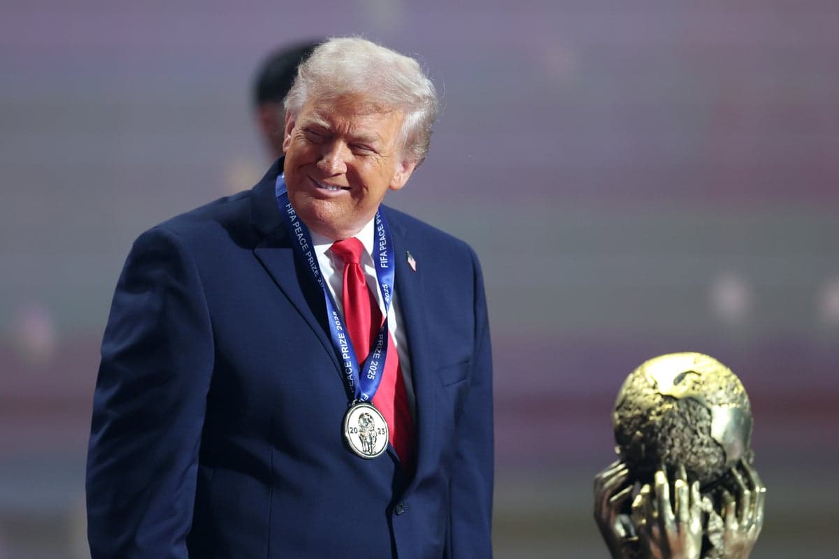 President Donald Trump gestures while speaking on the phone, featured in a black and white graphic, contrasted with an artistic rendering of the World Cup trophy and stadium lights.