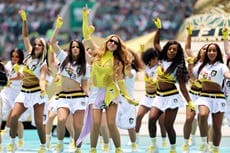 Shakira performing at the 2026 World Cup opening ceremony in Mexico City, with vibrant lights and a packed stadium.