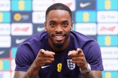 Thomas Tuchel at a press conference announcing England's World Cup squad, with Ivan Toney's name visible on a team sheet.